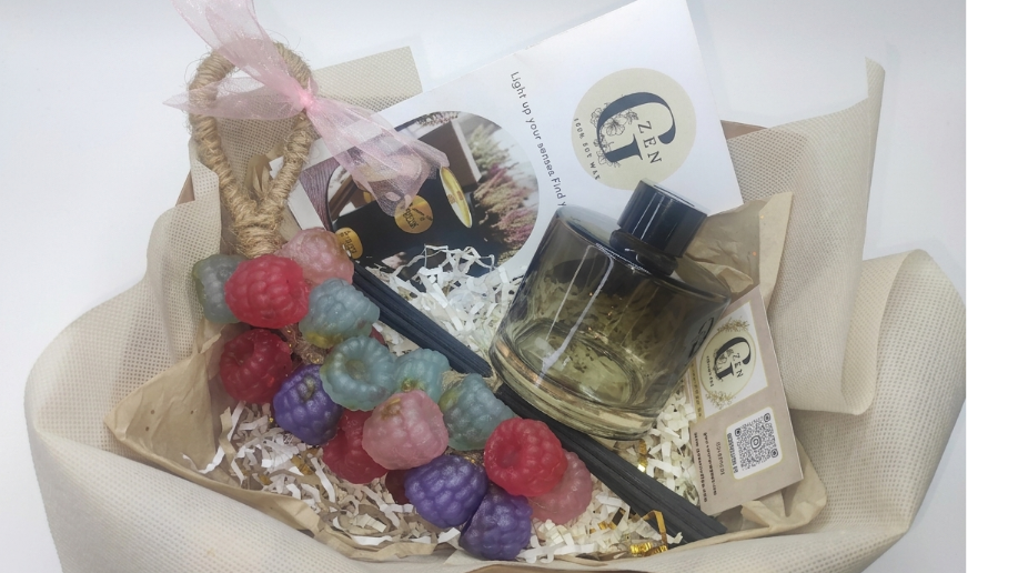 Luxury gift box featuring a 200ml glass reed diffuser with black sticks and a colorful hanging grape soap on a rope by Gzen Candles.