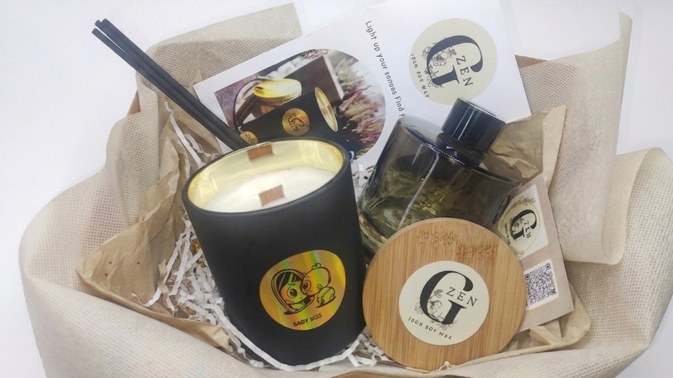 Luxury gift set featuring a large 400g black soy candle with a wooden wick and a 200ml glass reed diffuser with black sticks by Gzen Candles.