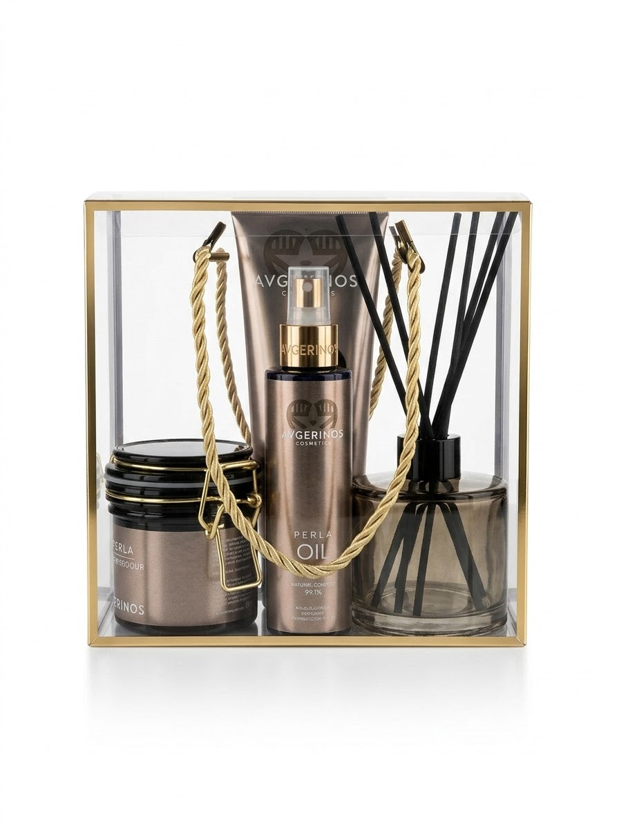 A luxury gift set in a clear acrylic box with a gold frame, containing avgerinos Perla body oil spray ,a matching Perla body scrub jar, and a reed diffuser by Gzen candles with gold rope handles. Perfect for gift in Cyprus buy online ship worldwide.