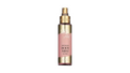 A single bottle of Avgerinos body Mist on a plain white background. The bottle is a frosted glass with a metallic gold spray top and base, featuring a pink label with gold lettering. This is from fairy dust collection by Avgerinos Cosmetics. Spray for body hair and face smelling wonderful for summer 
