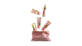 A pink cosmetic pouch with gold lettering reading 'AGVERINOS' sits on a white background, with several pink and gold cosmetic tubes and bottles floating above it.
A gift set of fairy dust collection . 