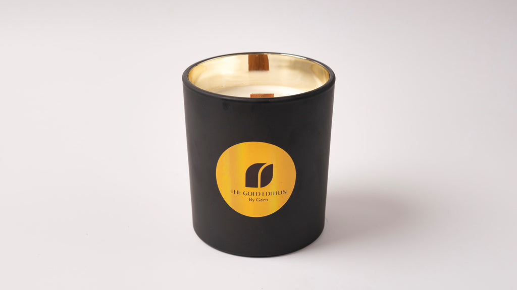 Luxury black candle with gold interior and logo of gzen candle on a white background.
Gold edition by Gzen smells fresh. With wood wick and soy wax 