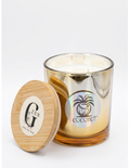 A coconut-scented soy candle in a clear glass jar with a metallic gold finish, shown next to its round bamboo lid on a white background. Gzen candles buy online Limassol candle shop, Cyprus .