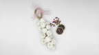 Decorative wreath with white berries, handmade soap on a robe on a white background
