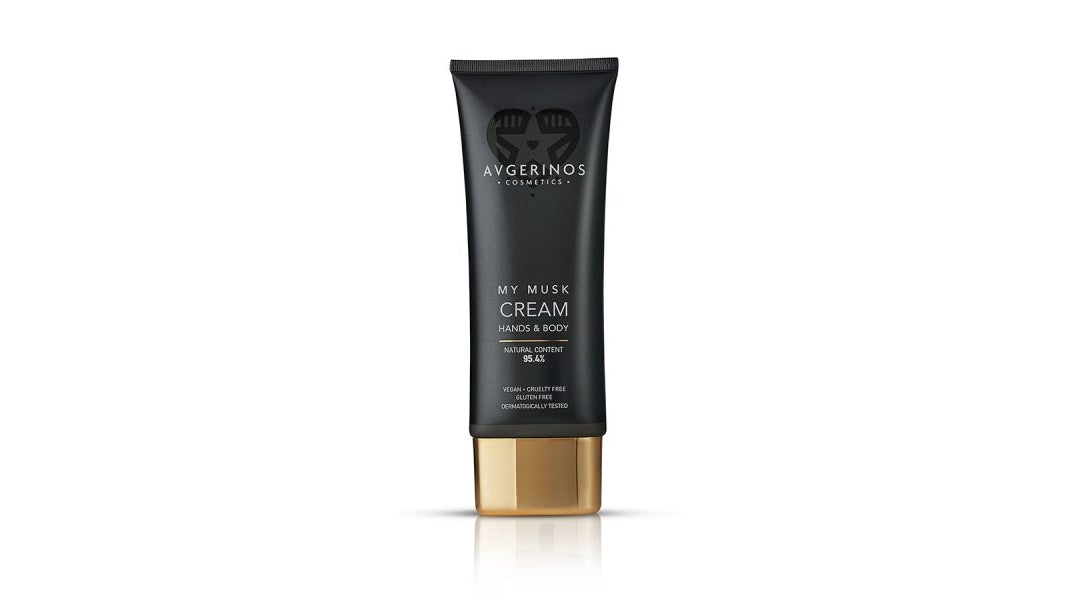 A black squeeze tube of Avgerinos My Musk Cream with a metallic gold cap, centered on a clean white background. A body and hand  cream smelling fresh. White Musk gzencandles .