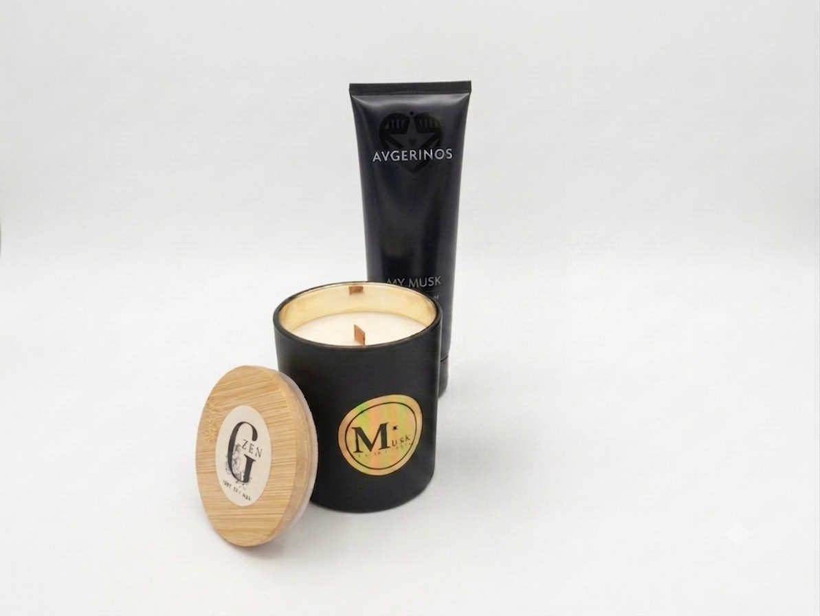 A black jar soy wood wick candle with a wooden lid placed beside it, and a body & hand cream my musk avgerinos gift set.The products have circular gold and white logos of gzen and avgerinos cosmetics, photographed on a clean white background. Gzen candle gift set base in Limassol buy online gift set for her.