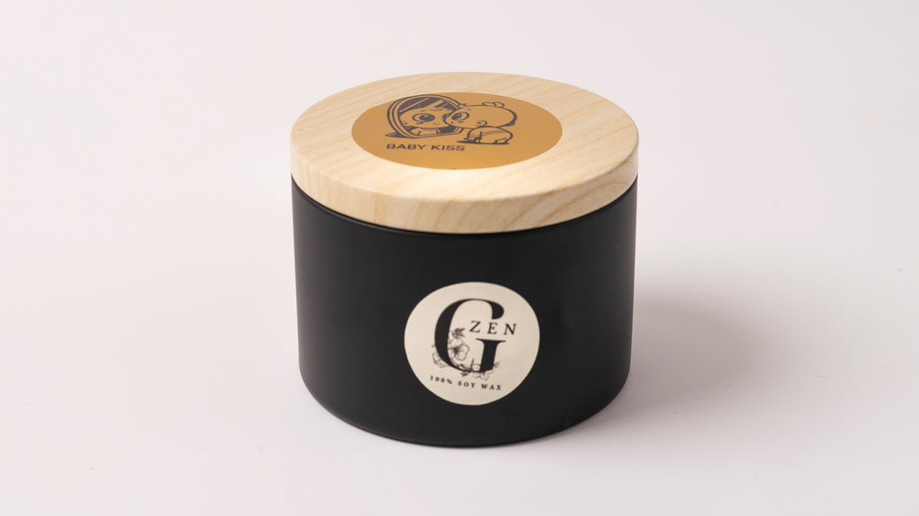 a scented soy candle handured in cyprus in a black metal tin with wood wick 