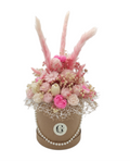 a flower box with scented soy wax pink flowers that make a wonderful arrangement 