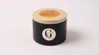 Black candle jar with wooden lid on a white background Cyprus
