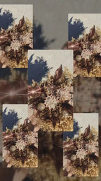 A decorative floral arrangement featuring faux succulent flowers in muted pink and beige tones, mixed with glittery bronze-brown leaves, gold glitter pinecones, and delicate beige filler stems on a plain white background.