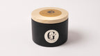 Black container with wooden lid featuring 'G Zen' branding on a white background