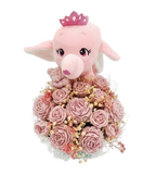 A pink plush toy pig wearing a small pink crown, nestled among pink artificial wax scented roses and dried flowers, isolated on a white background.